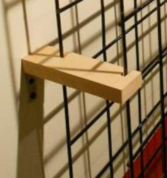 a close up of a wooden shelf with metal bars