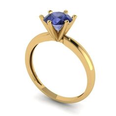 a yellow gold engagement ring with a blue sapphire stone