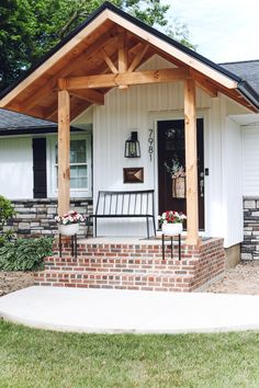 a small white house with a porch attached to it