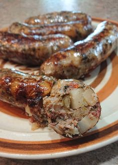 two sausages are sitting on a plate