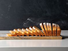 a loaf of bread sitting on top of a cutting board