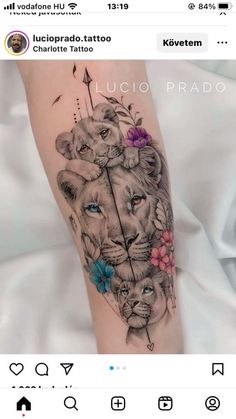 a woman's leg with a tattoo on it and an image of two lions