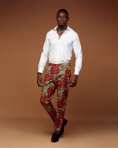 Zanaani's classic trousers are designed from durable cotton or poly-cotton in a slimfit silhouette. Crafted in African print they're detailed with abstract prints, side pockets and belt loops. Achieve a more casual look by teaming with white sneakers or a professional look by pairing with your favorite white shirt or blazer jacket. PRODUCT DETAILS -Button and concealed zip fastening at front -Composition:Poly-cotton -Dry clean or machine wash with like colors -Slimfit Fit  -Belt Loop -Fixed waistband -Side pocket SIZE GUIDE Size :      S                           M                         L                        XL                      2XL                 3XL                                                                          Waist:     32                        35 Attire For Wedding, Photoshoot Party, Pants Colorful, Classic Trousers, Men Gifts, Handmade African, African Men, African Attire, Birthday Photoshoot