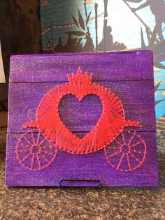 a purple box with a red heart drawn on it