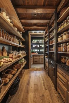 a kitchen filled with lots of wooden shelves