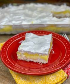 a red plate topped with a piece of cake