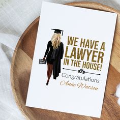 a graduation card with the words, we have a lawer in the house congratulations