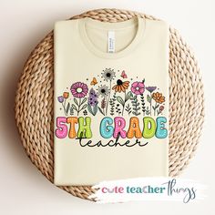 a t - shirt with the words 5th grade teacher written in colorful flowers on it