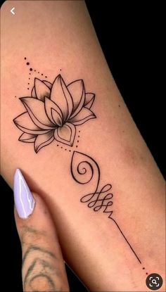 a woman's leg with a tattoo on it and a flower in the middle