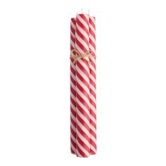 two red and white striped candles tied with twine on the end, against a white background