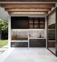 an outdoor kitchen with two sinks and cabinets