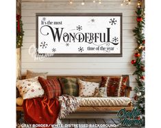 a wooden bench sitting in front of a wall with a sign on it that says, it is the most wonderful time of the year