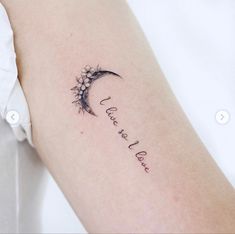 a woman's arm with a tattoo that reads, i love you to the moon and back