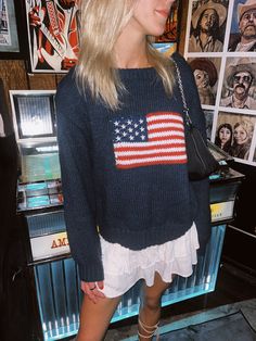 We are loving this American Flag Sweater. Featuring a bold flag design, this cozy sweater is perfect for the fall weather. The soft knit fabric and relaxed fit make it great for layering or wearing on its own. Pair it with denim shorts or jeans for a timeless, casual look. The Details Stitched American Flag on Front Ribbed Hem and Cuffs Rounded Neckline 100% Acrylic [#other] Wash With Like Colors Machine Wash Cold Do Not Bleach [/other] Rl American Flag Sweater, Usa Flag Sweater Outfit, Flag Sweater Outfit, American Sweater, Going Out Skirts, Flag Sweater, American Flag Sweater, Mini Skirt Dress, Bodycon Dresses Casual