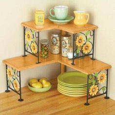 three tiered shelving unit with plates and bowls