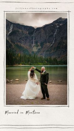 a man and woman standing next to each other in front of a body of water