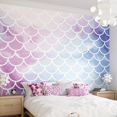 a bedroom with a large wall mural in the shape of a mermaid's tail