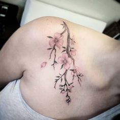 a woman's stomach with pink flowers on it