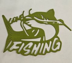 the word fishing is cut out of green paper