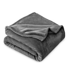 two blankets folded on top of each other, one is gray and the other is black