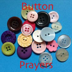 many different colored buttons on a blue surface