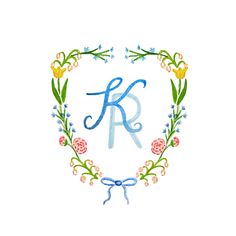 the letter k is surrounded by flowers and leaves in a heart shaped frame with an embroidered monogram