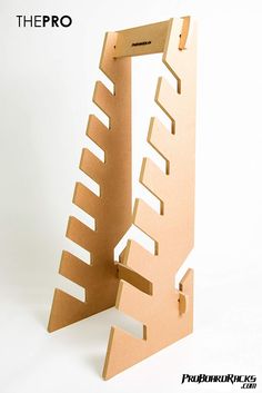 a cardboard sculpture with an open door on it's side and the bottom part cut out