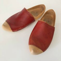 "This is a great pair of Dutch clogs. They are about a size 8 US. They are a beautiful rusty orange red leather, some cracks on the trim from age. Wooden clog very nice condition. Unsigned, we'll made.  See photos some scuff on the leather, a little leather conditioner will make it look nice as its just a surface blemish.  Measurements: Inside heel-toe 8.5\" Inside wides point near toes 3.5\" Inside width near heel 2.5\" Outside heel to toe 11\"" Retro Mules With Wooden Heel And Round Toe, Vintage Brown Mules With Leather Sole, Retro Closed Toe Mules With Wooden Heel, Vintage Brown Mules With Leather Footbed, Orange Round Toe Clogs With Rubber Sole, Vintage Closed Toe Mules With Wooden Heel, Vintage Brown Clogs With Round Toe, Orange Leather Round Toe Clogs, Retro Brown Closed Toe Clogs