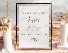 a sign that says guess how many kisses for the soon - to - be mrs