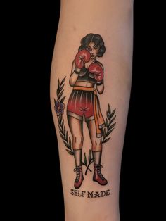 a woman with boxing gloves on her leg