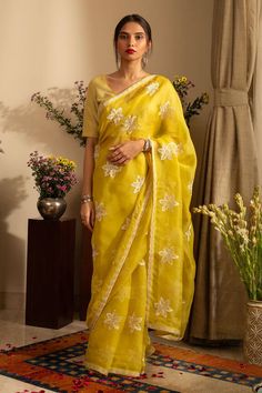 Lemon yellow saree crafted in pure silk organza with phool embroidery. Paired with an unstitched blouse piece and an unstitched petticoat. - Aza Fashions Yellow Anarkali Style Pre-draped Organza Saree, Yellow Organza Pre-draped Saree For Eid, Yellow Resham Embroidered Pre-draped Saree For Festivals, Yellow Pre-draped Saree With Resham Embroidery For Festive, Yellow Pre-draped Saree With Resham Embroidery For Festive Occasions, Yellow Embroidered Organza Set, Festive Yellow Pre-draped Saree With Resham Embroidery, Yellow Organza Pre-draped Saree For Party, Yellow Chanderi Pre-draped Saree With Resham Embroidery