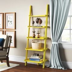 a living room with a yellow leaning shelf next to a window