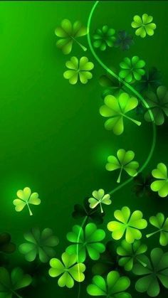 four leaf clovers with green background for st patrick's day greeting card or wallpaper