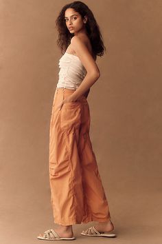 Too hot to barrel . Defined by a cool, curved leg that gently tapers at the ankle for a nonchalant-yet-elegant offering, the barrel-leg look is a standout silhouette. | Parachute Curve Barrel Pants by Pilcro in Orange, Women's, Size: 26, Cotton/Lyocell/Tencel at Anthropologie Chic Tapered Leg Parachute Pants For Summer, Chic Summer Parachute Pants With Tapered Leg, Chic Straight Leg Parachute Pants With Belt Loops, Chic High-waisted Relaxed Fit Parachute Pants, Chic Loose-fit Cargo Pants For Fall, Chic Loosely Fitted Cargo Pants For Fall, Chic Relaxed Fit Cargo Pants, Chic Fitted Parachute Pants For Fall, Chic Fitted Wide-leg Parachute Pants