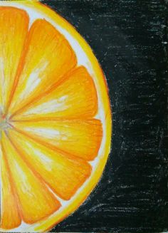 a drawing of an orange cut in half on a black board with colored pencils