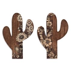 two wooden cactus wall hangings with flowers on them