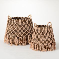 two woven baskets sitting next to each other