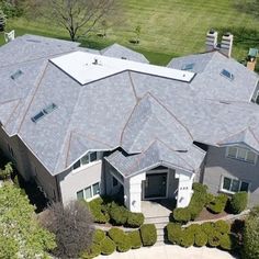 an aerial view of a large house with many windows