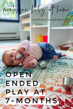 a baby is laying on the floor with a phone in her hand and text reads open ended play at 7 - months