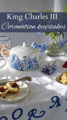 a table topped with plates of food next to a teapot and cup filled with water