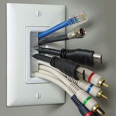 several cables are plugged into an electrical outlet