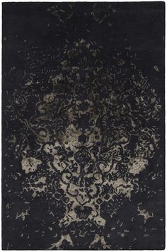 a black and white rug with an intricate design