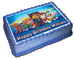 a blue birthday cake with paw patrol characters on the front and bottom layer is shown