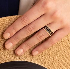 A truly unique statement ring. Beautifully crafted in solid 18k yellow gold and black enamel with hand cut coin edges. An eternity design featuring the Latin word for horse, EQUUS, snaffle bits and star motifs. 9mm wide. Hand made in the US. Wear either side facing up! Bold on its on, or pair with our gold stack ring. A Stunning combination! Available in sizes 6, 6.5, 7, 7.5, 8 (Contact us for other size options) Made to Order. Please allow 4-6 weeks for delivery. Latin Word, Snaffle Bit, Stack Ring, 18k Gold Ring, Enamel Ring, Midnight Black, Black Enamel, Stacking Rings, Statement Ring