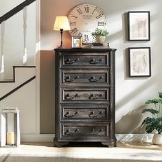 an old chest of drawers with a clock on top