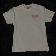 White & Pink Gallery Dept. T-Shirt Pink Gallery Dept Shirt, White Graphic Tee Shirt With Branding, White Graphic Tee With Branding, Trendy White T-shirt With Branding, White Graphic Design Shirt For Spring, White Logo Print Graphic Tee, White Summer Shirt With Branding, White Branded T-shirt For Summer, Trendy White T-shirt With Logo Print