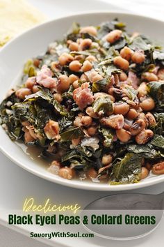 a white plate topped with beans and greens