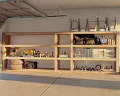 an open garage with shelves filled with items