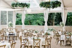 tables and chairs are set up for an outdoor wedding reception