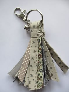 a keychain made out of fabric with stars on it